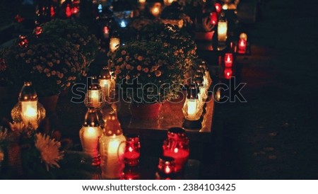 Cemetery Grave Tombstone Decorated with Candle Lanterns on All Saints Day Evening