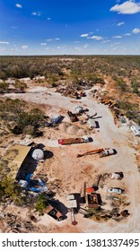 Cemetery Of Old Abandoned Rusty Trucks And Mine Machinery In Lightning Ridge Opal Mining Town In Australian Outback Seen From Above On A Hot Sunny Day.