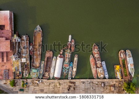 Cemetery of old, decommissioned ships. Water area of the river port of Dnepropetrovsk, Ukraine. Dnieper river waters. Top view.