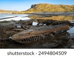 the cemetery of old ships on the seashore in the village of Teriberka, Murmansk region