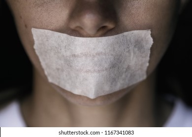 Censorship In The Modern World: A Man's Mouth Sealed With An Adhesive Tape, Close-up