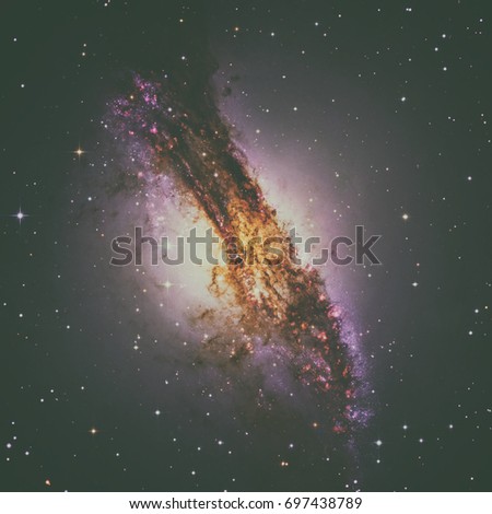 Centaurus A or NGC 5128 is a prominent galaxy in the constellation of Centaurus. The center of the galaxy contains a supermassive black hole. Elements of this image furnished by NASA.
