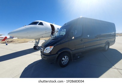 CENTENNIAL, COLORADO - MARCH 3, 2021: Mercedes Benz Sprinter Is Parked By A Private Jet