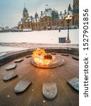 Centennial flame at parliament hill in Ottawa, Ontario, Canada commemorating 100th anniversary of Canada as a Confederation. Winter travel destination, capital city. Mobile phone picture.