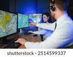 Center of dispatching maintenance. Portrait of cheerful woman and man working via headset microphone while sitting on navigation controller board.