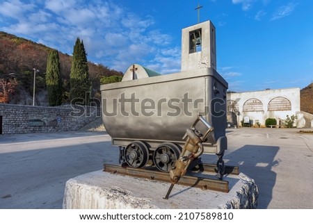 the center of Rasa with a mining wagon, in the background a church of St. Barbara, Rasa, Istria, Croatia