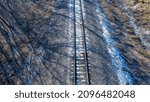 centered elevated view of railroad track in winter