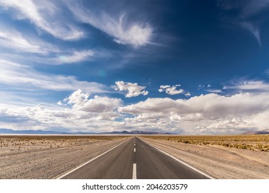 Centered road middle POV in a salt field. Salinas Grandes, Jujuy,  Northern Argentina. Symmetrical landscape photography.
