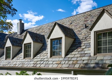 Centerport, NY USA - May 12, 2021: A Slate Roof And Four Dormers In An Old Building, Once Part Of An Estate In Centerport, NY, In Suffolk County, Long Island