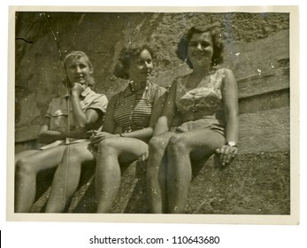 Central Bohemia, CZECHOSLOVAK REPUBLIC, CIRCA 1950 - three girls on summer break (in bathing suits) - circa 1950