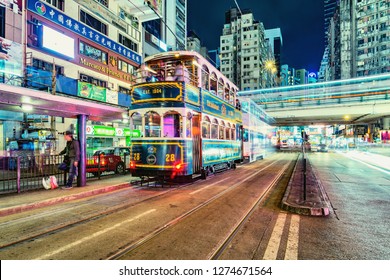 Central District, Hong Kong - December 11, 2016: Retro Tram And People On The Evening City Street.