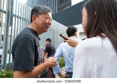 Central Government Offices, Hong Kong - September 23, 2014: 2014 Hong Kong Class Boycott Campaign. A Journalist Is Interviewing Lee Cheuk Yan About The View Of The Campaign