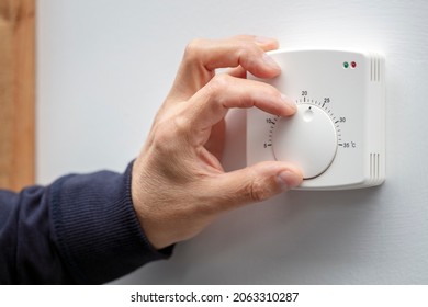 Central Heating thermostat control dial adjustment - Shutterstock ID 2063310287