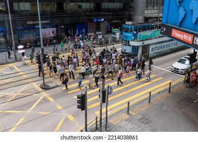 Central, Hong Kong 18 August 2021: People Cross The Street In Business District