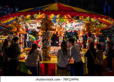 Central, Hong Kong  - January 04, 2018 :  People palying games in a large carnival in the heart of finanial center of Asia.