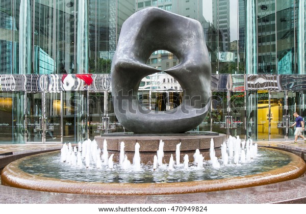 CENTRAL , HONG\
KONG , JULY 1, 2016 : Art statue in front of Hong Kong Station and\
IFC mall at Central district.\
