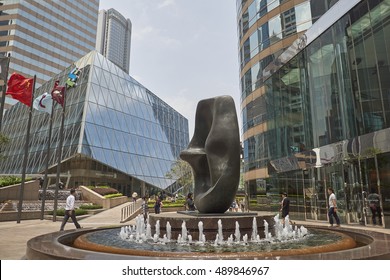 CENTRAL, HONG KONG - MAY 2016: Exchange Square with fountain, Henry Moor 'Oval with Points' sculpture and Exchange Square podium building in downtown Hong Kong.