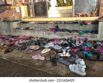 Central Java, Indonesia - May 2, 2022: Sandals In Front Of The Entrance To The Mosque.  The Number Of Sandals Is A Sign Of The Many Congregations Who Take Part In Religious Activities