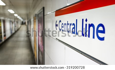 Central Line sign. Direction sign on the wall of a London Underground station pointing travellers in the direction of the red Central Line.