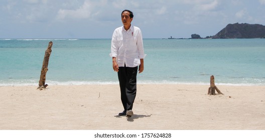 Central lombok, Indonesia - October 20 2017 : portrait of the seventh president of the Republic of Indonesia during a visit to Kuta Lombok, walking on the beach, white shirt and beautiful Kuta beach  - Shutterstock ID 1757624828