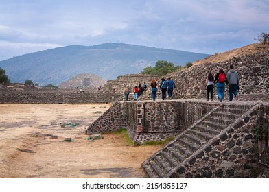 Teotihuacán, Central Mexico -March 5, 2016: Tourists visit the ruins of the ancient city of Teotihuacán. View from the Avenue of the Dead with the Pyramid of the Moon in the background.
