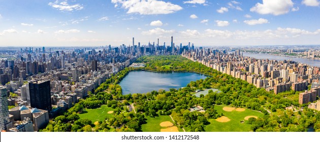 Central Park aerial view, Manhattan, New York. Park is surrounded by skyscraper. Beautiful view of the Jacqueline Kennedy Onassis Reservoir in the center of the park. - Shutterstock ID 1412172548