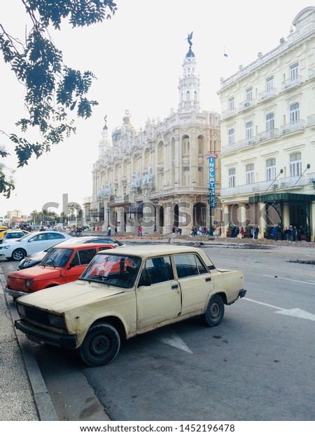 Central\
Park, Havana, Cuba, 11 February 2016. An old Lada car and Fiat 126\
car parked up in Central Park, Havana,\
Cuba.