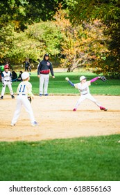 Central Park, New York, USA - 23 October, 2016: Young Kids Playing Softball. Vertical Studio Shot