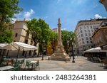 Central Plaza de Santa Catalina with the commemorative monument of the Immaculate Conception and its typical terraces to enjoy tapas