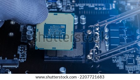 Central Processing Unit (CPU) Replacement by a repairman maintenance, updating the motherboard's hardware, microprocessor chipset, electronic engineering,