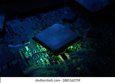 Central processor unit at printed circuit board. Low-key photo.
