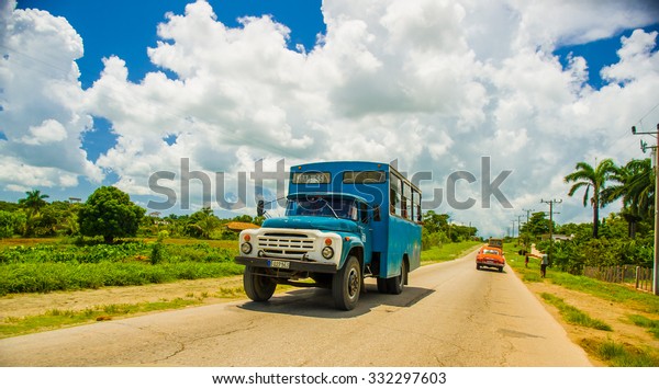 CENTRAL ROAD, CUBA -\
SEPTEMBER 06, 2015: amazing view of vintage retro classic bus truck\
riding in the road