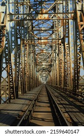 Central Shot Of One Way Track On An Old Rusty Train Bridge