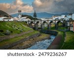 Central square of Ribeira Grande and the Bridge Ponte dos Oito Arcos, at Sao Miguel Island, Azores, Portugal.