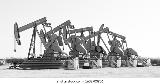 Central Texas/USA - January 2020: Working pump jacks and oil field equipment in central Texas