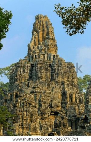Central tower and carved faces at bayon, last temple of king jayavarman vii in angkor thom city, angkor, unesco world heritage site, siem reap, cambodia, indochina, southeast asia, asia