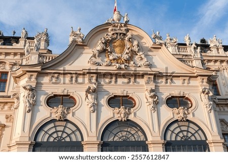 Central upper part of the main facade of Baroque palace Upper Belvedere of the 18th century illuminated by the evening sun, Vienna, Austria 