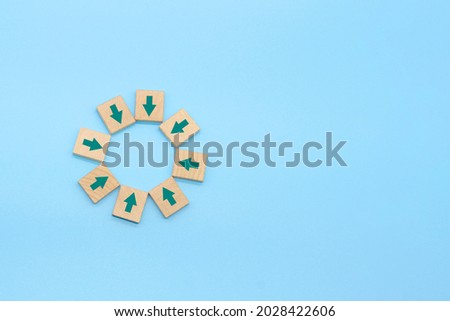centralization and teamwork concept , arrow sign on wood with blue background