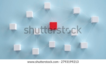 Centralized network connection hub concept with single red cube linked to surrounding white blocks