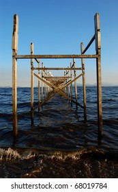 Centralized view of an old pier structure made of wood