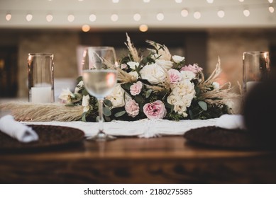 A centrepiece is a central object which serves a decorative purpose, often made from flowers, candles, or fruit, are a major part of the decoration for a wedding reception. selective focus