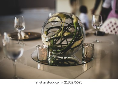 A centrepiece is a central object which serves a decorative purpose, often made from flowers, candles, or fruit, are a major part of the decoration for a wedding reception. selective focus