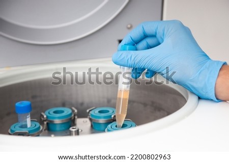 centrifuge of cells at cell culture laboratory