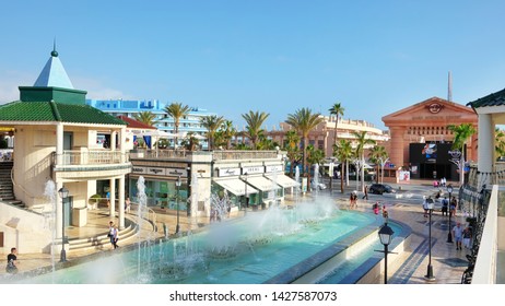 Centro Commercial Safari, Las Americas, Tenerife, Canary Islands, Spain - July 17, 2019: Popular Plaza Featuring A Water Fountain Surrounded By Hotels, Restaurants, Nightlife Venues And Designer Shops