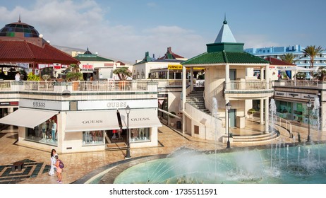 Centro Commercial Safari, Las Americas, Tenerife, Canary Islands, Spain - May 17, 2019: Popular Plaza Featuring A Water Fountain Surrounded By Hotels, Restaurants, Nightlife Venues And Designer Shops