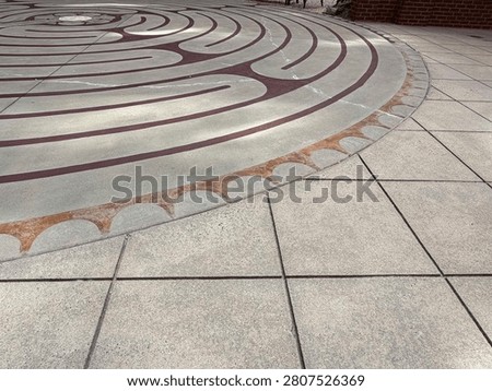 A centuries-old labrinth pattern decorates this outdoor courtyard in uptown Charlotte. NC 2026