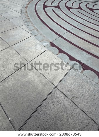 A centuries-old labrinth pattern decorates this outdoor courtyard in uptown Charlotte. Detail. NC 2026