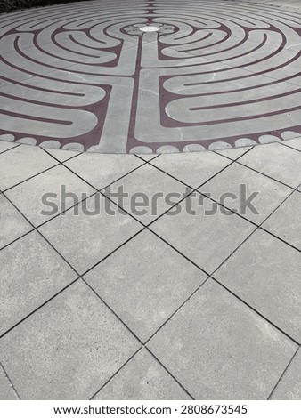 A centuries-old labrinth pattern decorates this outdoor courtyard in uptown Charlotte. Detail. NC 2026