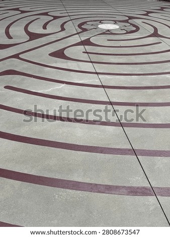 A centuries-old labrinth pattern decorates this outdoor courtyard in uptown Charlotte. Detail. NC 2026