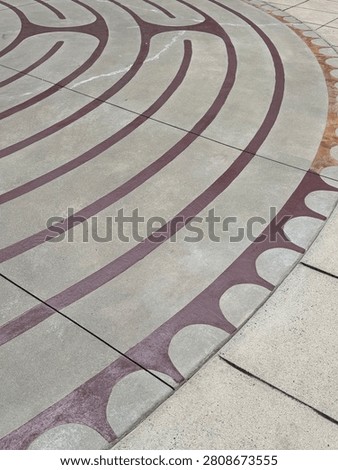 A centuries-old labrinth pattern decorates this outdoor courtyard in uptown Charlotte. Detail. NC 2026